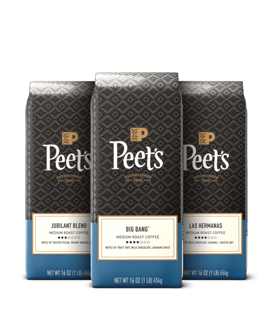Three Peet's coffee bags with different blends on a black background