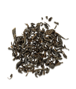 Dry black tea leaves on a white background